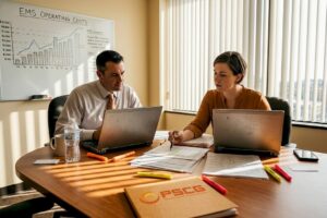 EMS managers reviewing financial data in office