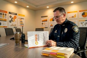 Police captain reviewing organizational assessment report