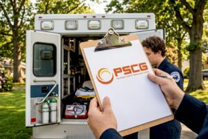 EMS responders working by open ambulance