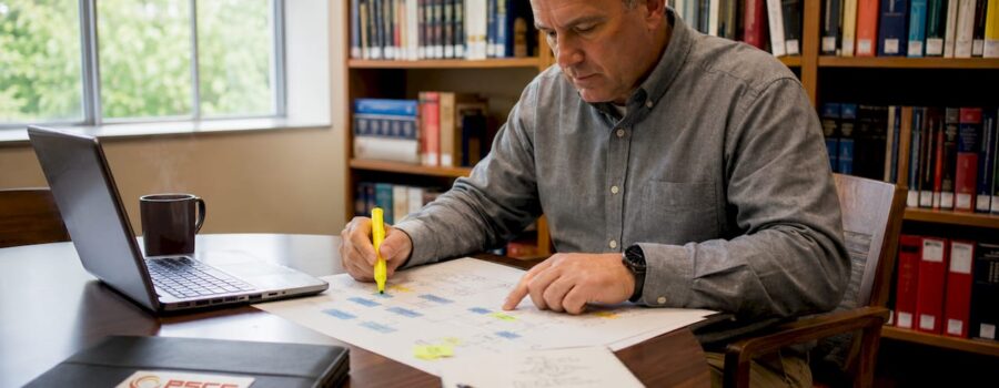 EMS leader reviewing strategy workflow document