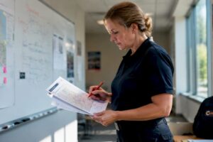 EMS supervisor reviewing response plan documents
