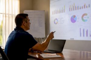 Hands interacting with EMS metrics dashboard