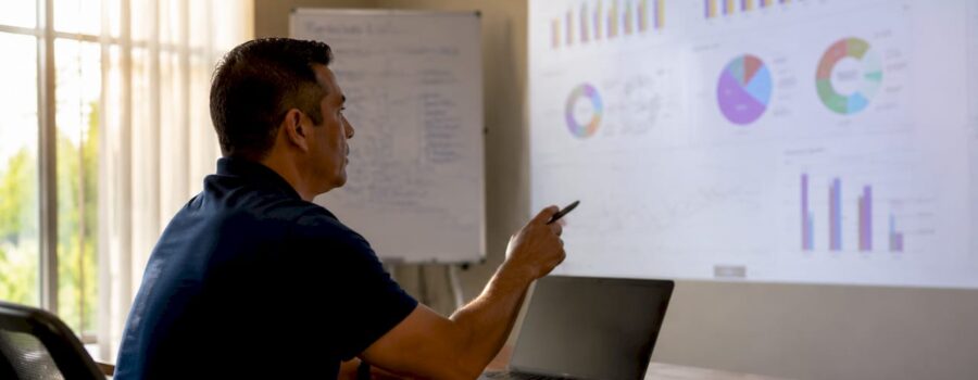 Hands interacting with EMS metrics dashboard