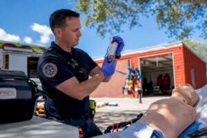 EMS leader examining whole blood unit with PSCG logo