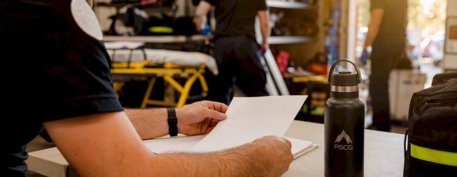 EMS professional preparing certification paperwork