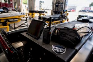 EMS tablet and radio on ambulance console