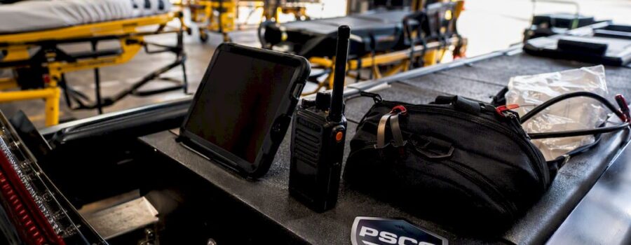EMS tablet and radio on ambulance console
