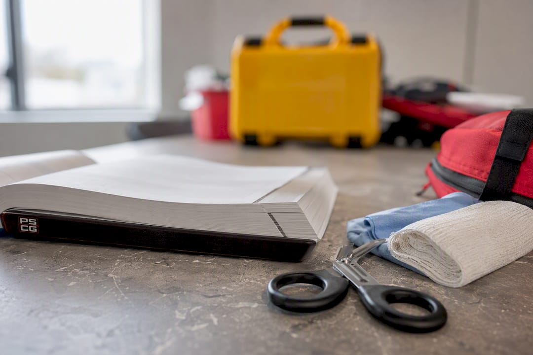 EMS training manual and equipment on table